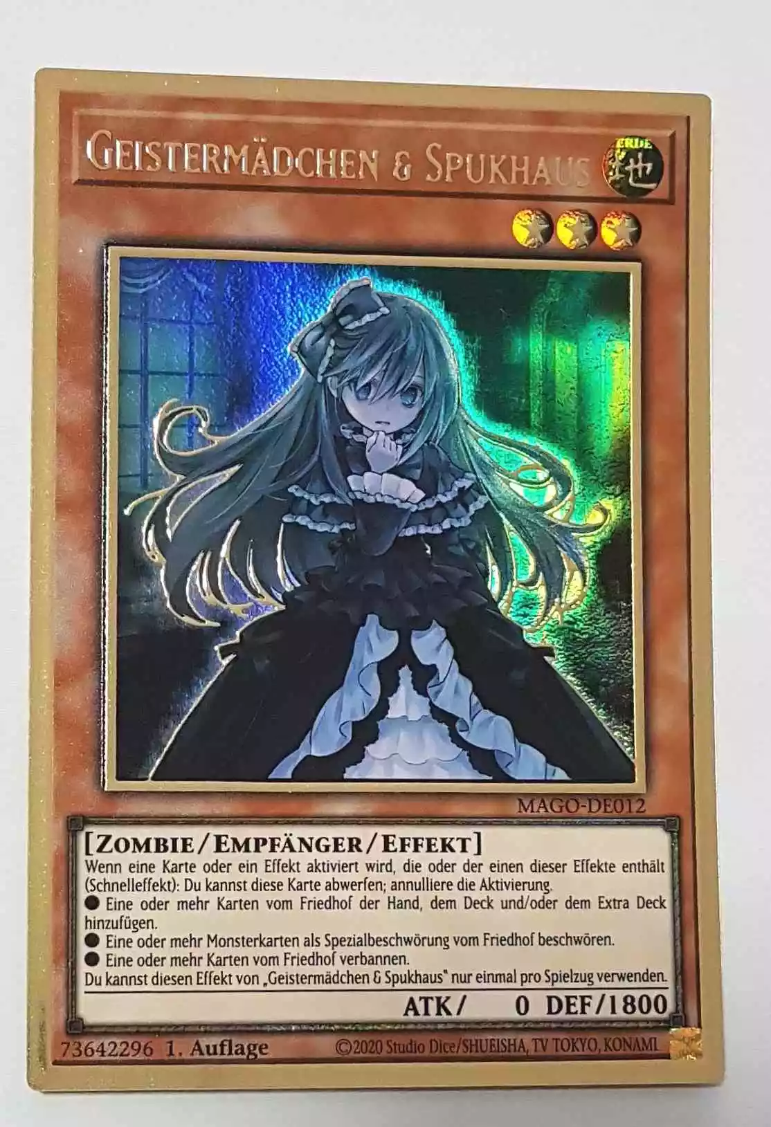 Geistermädchen & Spukhaus MAGO-DE012 ist in Premium Gold Rare Yu-Gi-Oh Karte aus Maximum Gold 1. Auflage