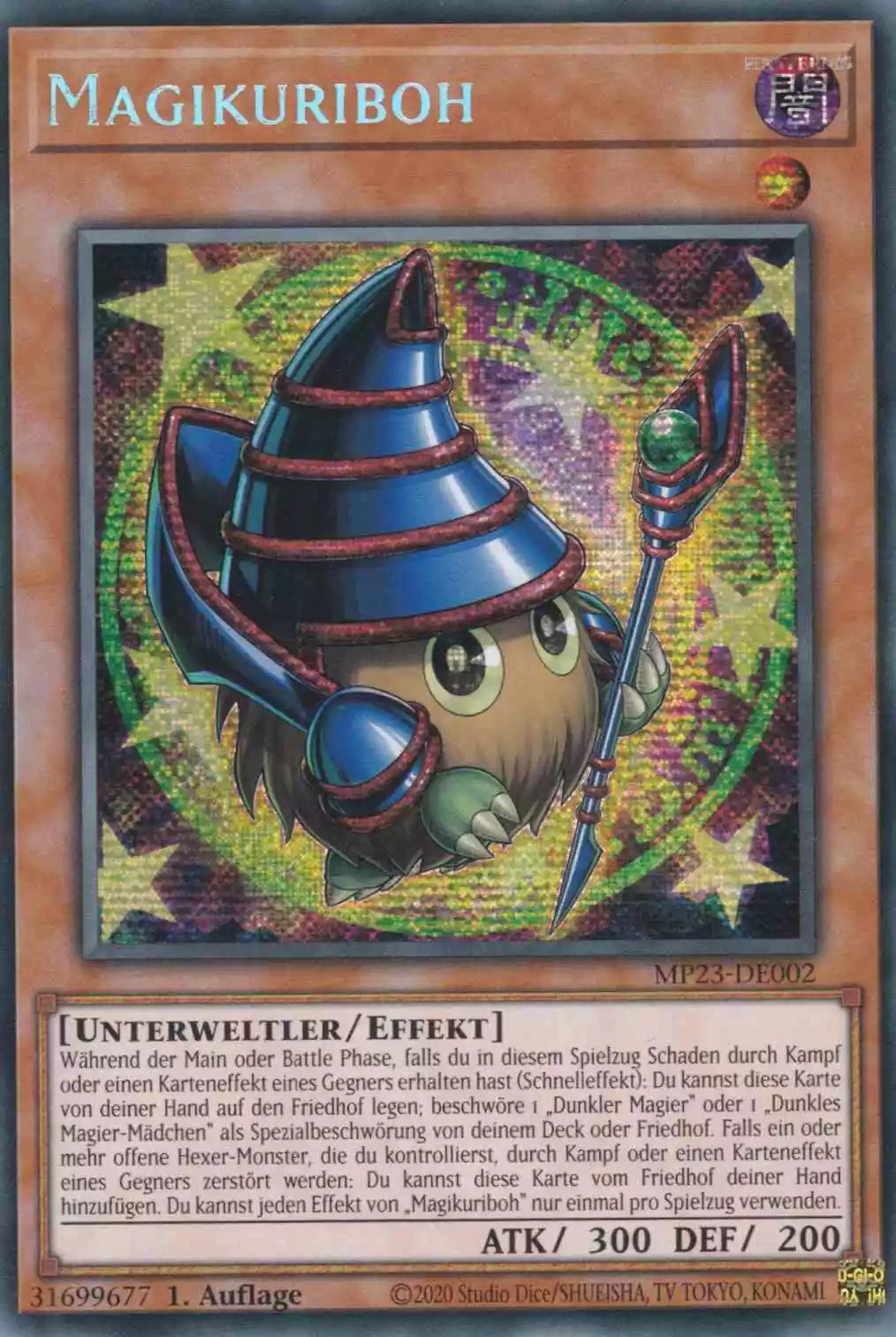 Magikuriboh MP23-DE002 ist in Prismatic Secret Rare Yu-Gi-Oh Karte aus 25th Anniversary Tin Dueling Heroes 1.Auflage