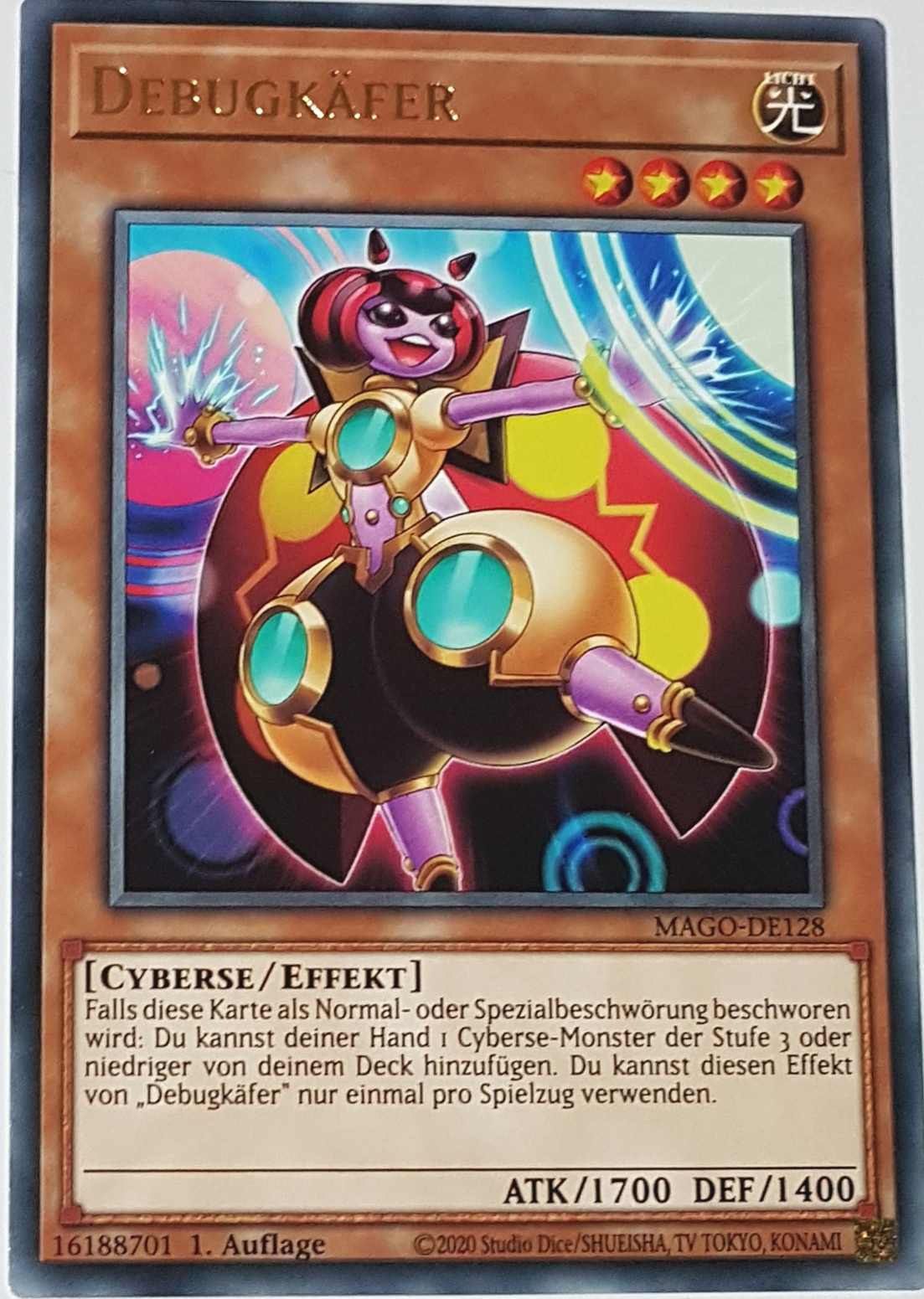 Debugkäfer MAGO-DE128 ist in Gold Rare Yu-Gi-Oh Karte aus Maximum Gold 1. Auflage