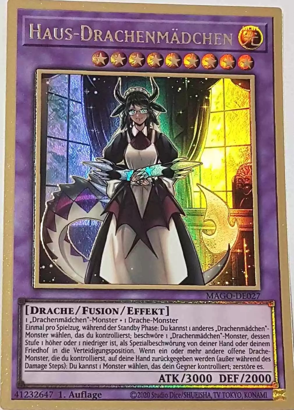 Haus-Drachenmädchen MAGO-DE027 ist in Premium Gold Rare Yu-Gi-Oh Karte aus Maximum Gold 1. Auflage