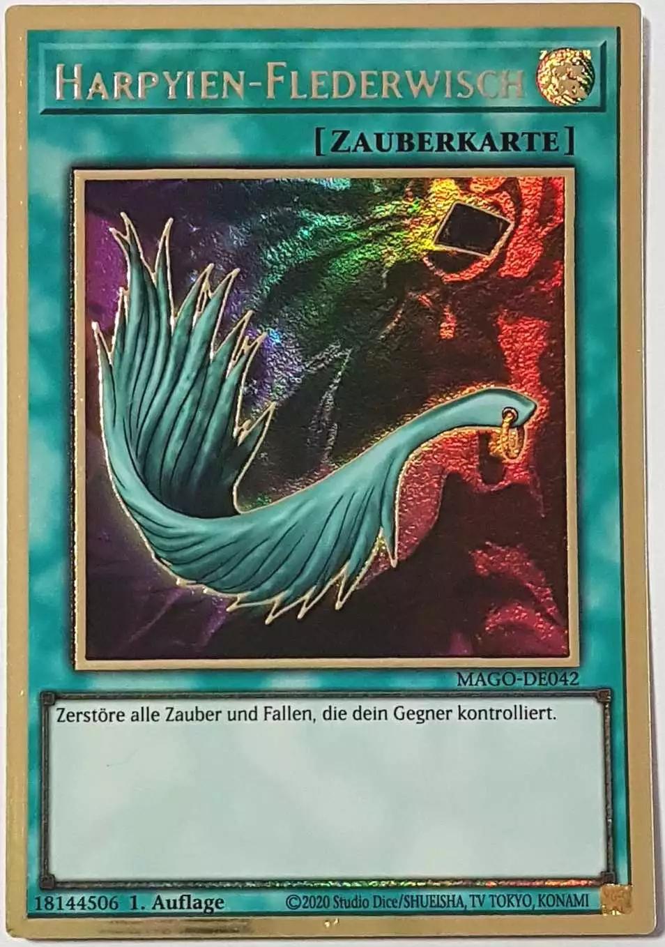 Harpyien-Flederwisch MAGO-DE042 ist in Premium Gold Rare Yu-Gi-Oh Karte aus Maximum Gold 1. Auflage