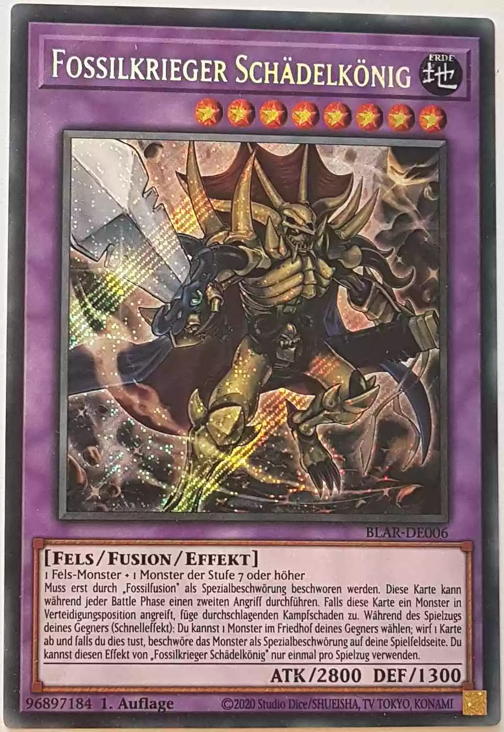 Fossilkrieger Schädelkönig BLAR-DE006 ist in Secret Rare Yu-Gi-Oh Karte aus Battles of Legend: Armageddon 1.Auflage