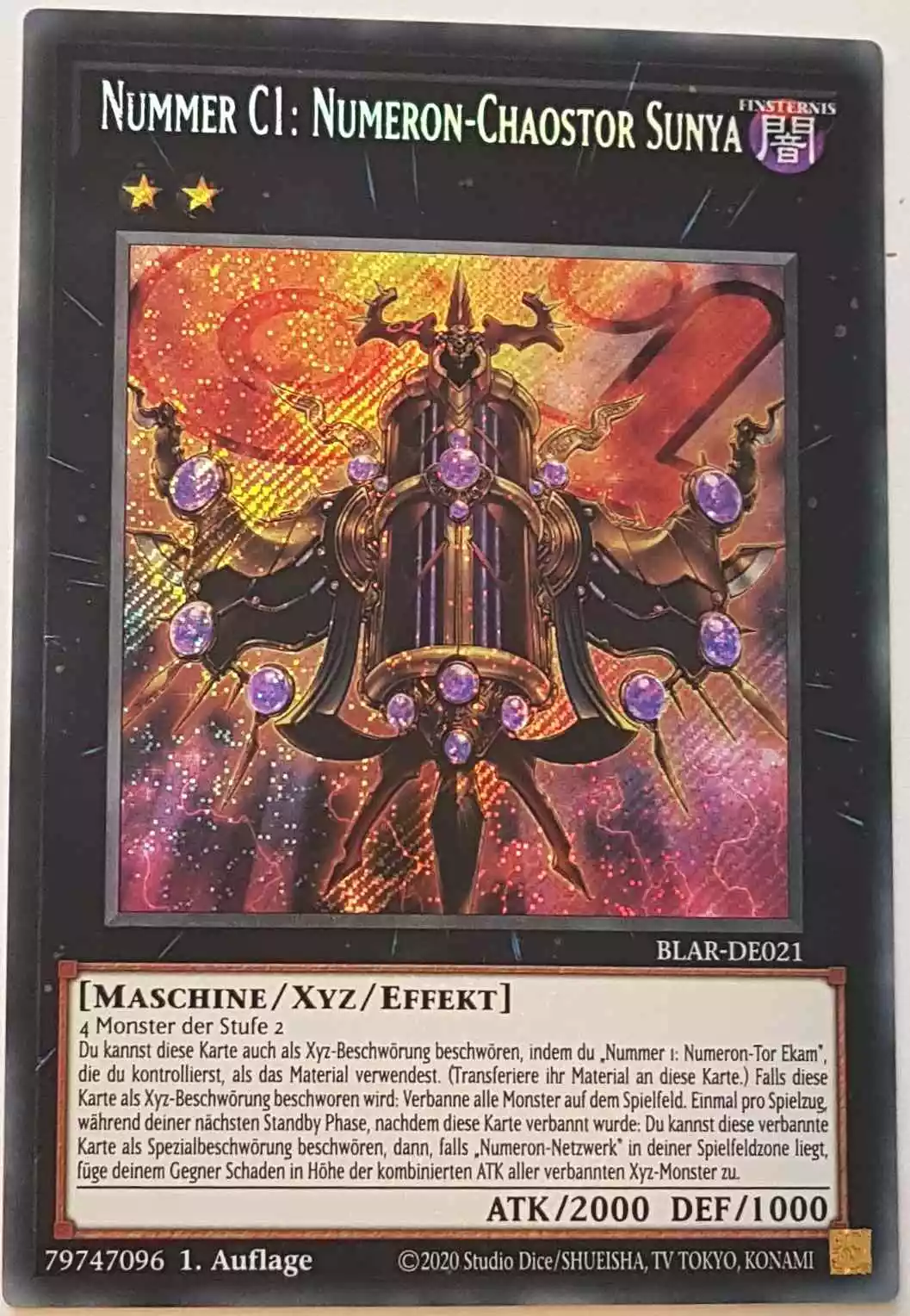 Nummer C1: Numeron-Chaostor Sunya BLAR-DE021 ist in Secret Rare Yu-Gi-Oh Karte aus Battles of Legend: Armageddon 1.Auflage