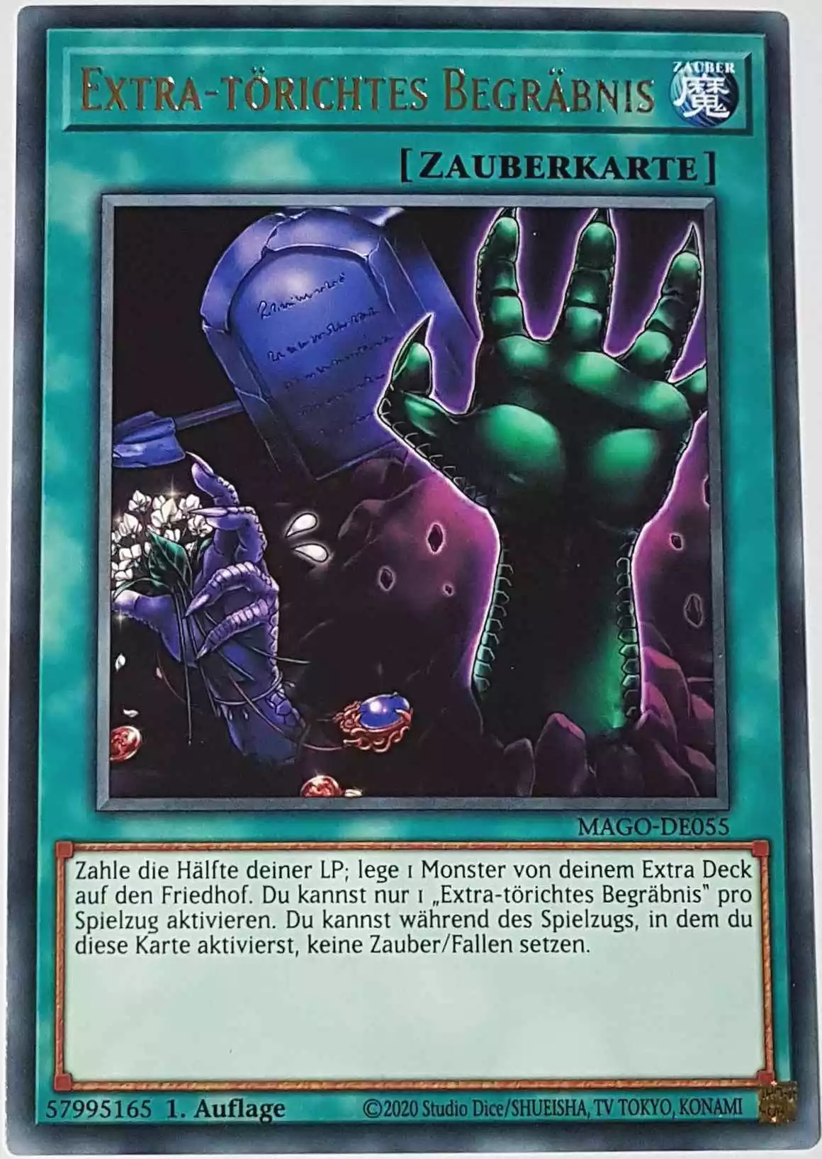 Extra-törichtes Begräbnis MAGO-DE055 ist in Gold Rare Yu-Gi-Oh Karte aus Maximum Gold 1. Auflage