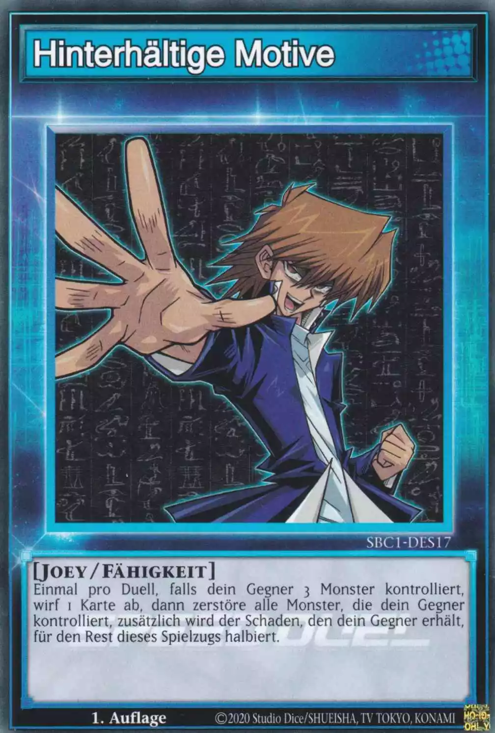 Hinterhältige Motive SBC1-DES17 ist in Common Yu-Gi-Oh Karte aus Streets of Battle City 1.Auflage
