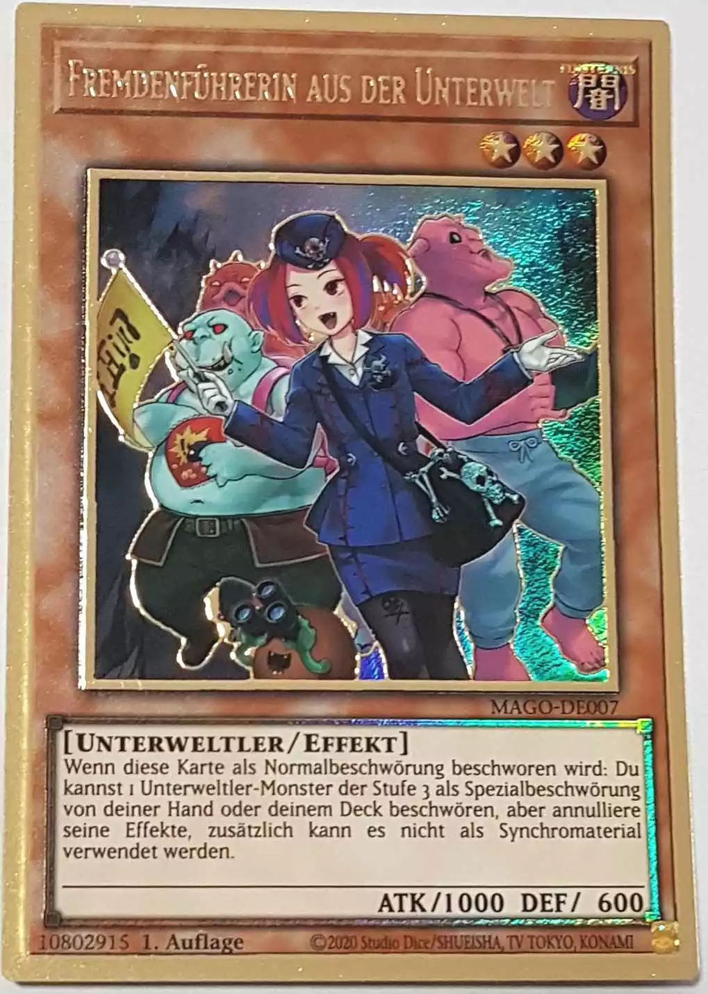 Fremdenführerin aus der Unterwelt (alternativ art) MAGO-DE007-1 ist in Premium Gold Rare Yu-Gi-Oh Karte aus Maximum Gold 1. Auflage