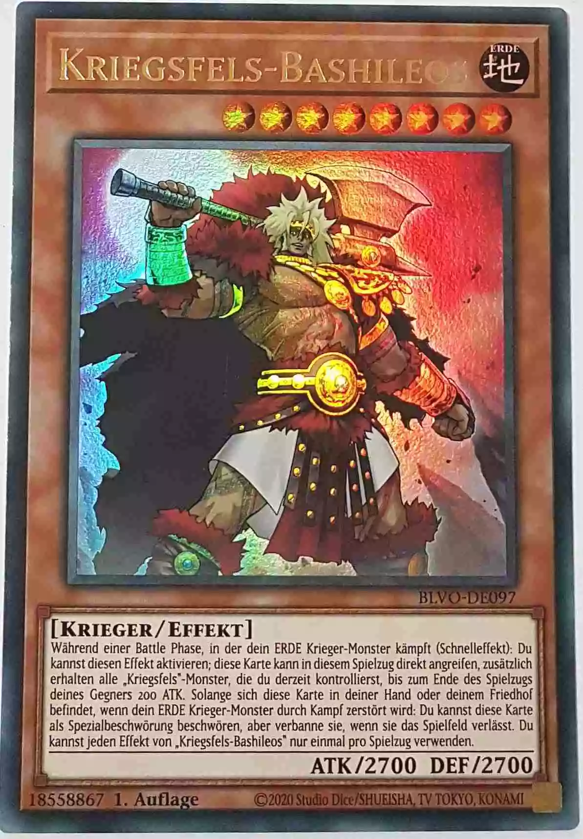 Kriegsfels-Bashileos BLVO-DE097 ist in Ultra Rare Yu-Gi-Oh Karte aus Blazing Vortex 1.Auflage