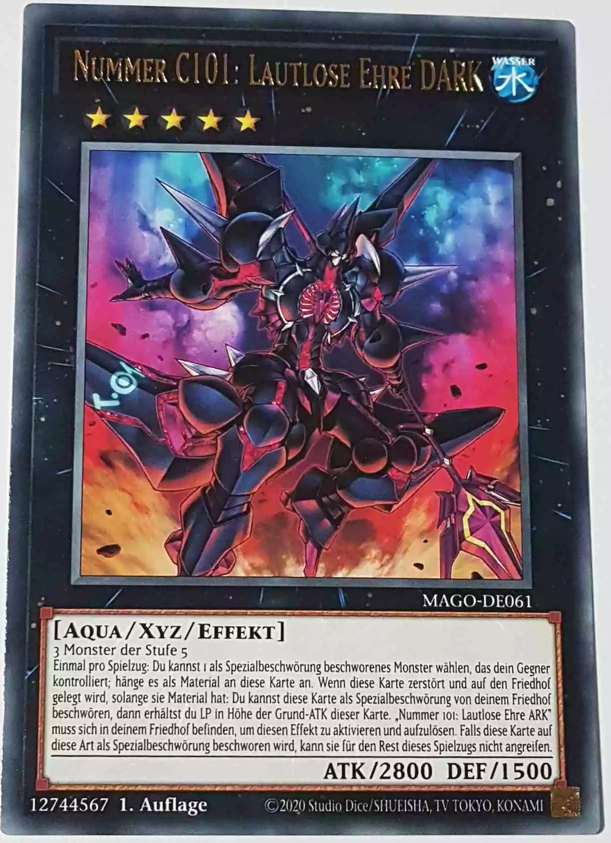 Nummer C101: Lautlose Ehre DARK MAGO-DE061 ist in Gold Rare Yu-Gi-Oh Karte aus Maximum Gold 1. Auflage