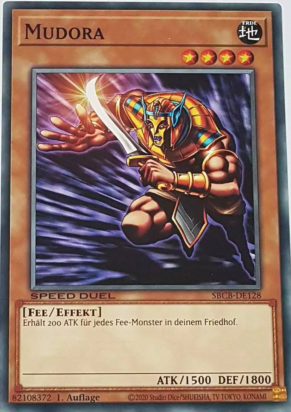 Mudora SBCB-DE128 ist in Common Yu-Gi-Oh Karte aus Speed Duel Battle City Box 1. Auflage