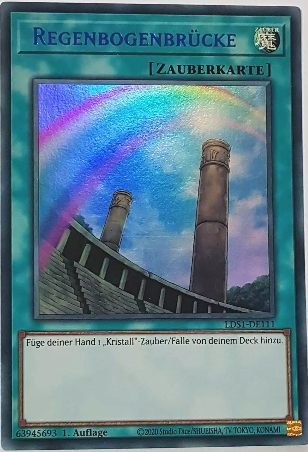 Regenbogenbrücke (blau) LDS1-DE111 ist in Colorful Ultra Rare Yu-Gi-Oh Karte aus Legendary Duelists: Season 1 1.Auflage