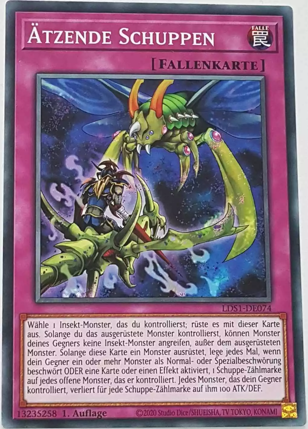 Ätzende Schuppen LDS1-DE074 ist in Common Yu-Gi-Oh Karte aus Legendary Duelists: Season 1 1.Auflage